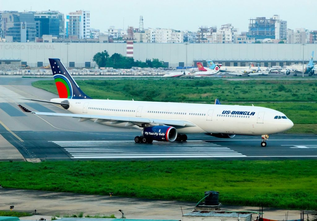 A large jetliner sitting on top of an airport runway