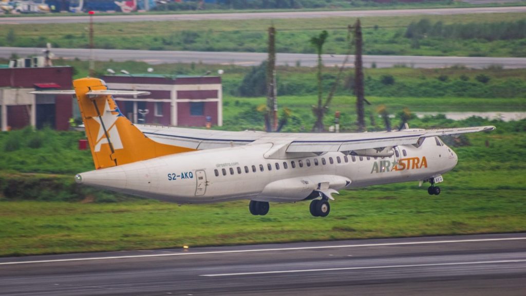 An airplane taking off from an airport runway